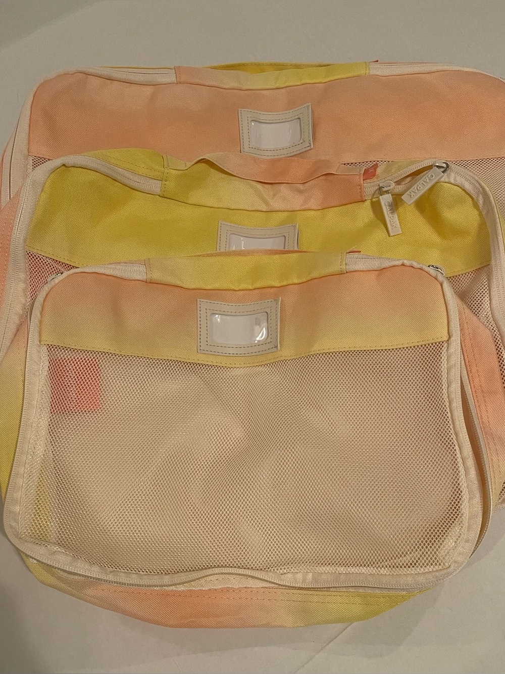 CALPAK Pastel Yellow and Peach Travel Packing Organizers - Women Bags Set of 3